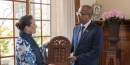 Princess Zahra Aga Khan receives a gift from Zanzibar's tourism and heritage minister Simai Mohammed Said in Lisbon, Portugal